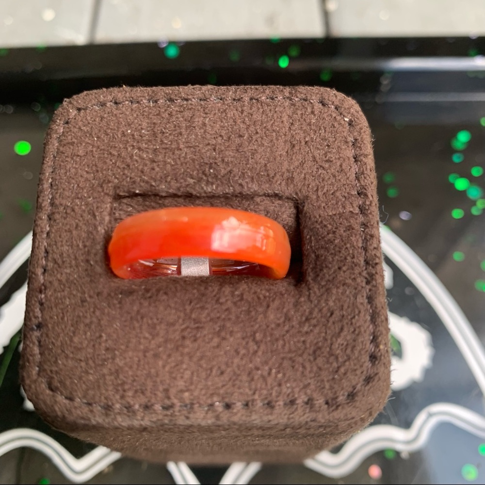 Imitation orange jade medium width band ring .